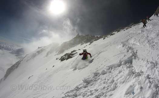 Tyler starts the Headwall. We were frankly amazed at how well this powder was bonding to blue ice a short distance underneath.