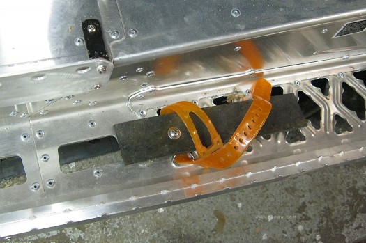 Tails of skis easily lash to the lattice holes in M8 running board.