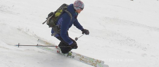 Mountain Equipment clothing review, Lisa skiing with jacket.