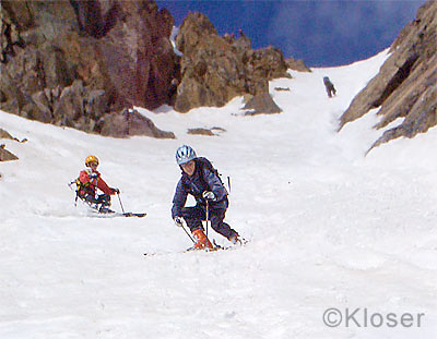 Heidi and Christian Kloser skiing Cross Couloir. 
