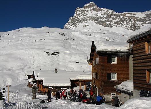 Sulzfluh Hut with the journalists milling around after various ski tours. 