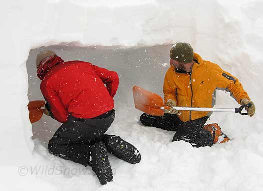 We practiced some speedy snowcave building. In this technique, you start with a wall that two or three people can dig side-by-side into, then after hollowing out most of your cave you wall up the opening with snow blocks and dig a lower elevation door portal. Amazing how fast this is compared to the mole burrow technique.