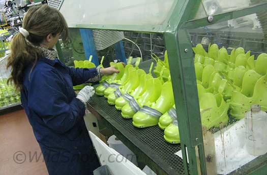 F1 boots being cleaned up for assembly.