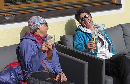 The WildSnow girls share a laugh over traditional refreshments. You literally walked about 200 feet from the bridge to the gasthaus sun porch. 