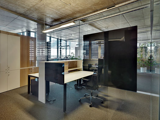 Typical cubicle for a Salewa desk jockey. They also have a fitness center, childcare facility, free-of-charge electric recharging station for hybrid vehicles, park with pond and bistro, cafeteria serving local foods, and espresso machines around every corner.