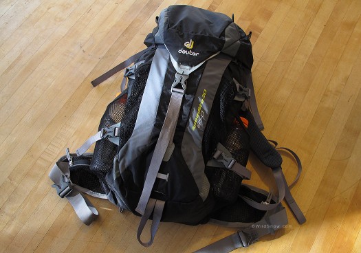 Deuter includes a back panel pouch and two mesh side pouches, but no diagonal ski carrry.