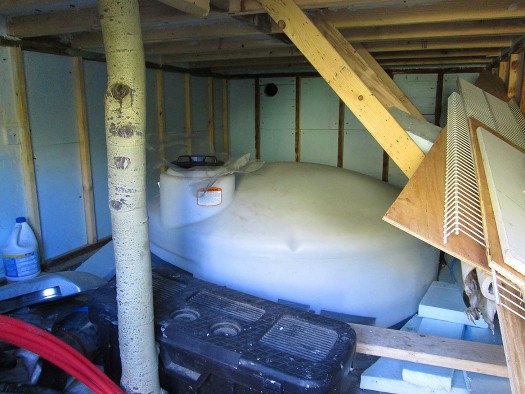 Water storage tank in insulated enclosure.