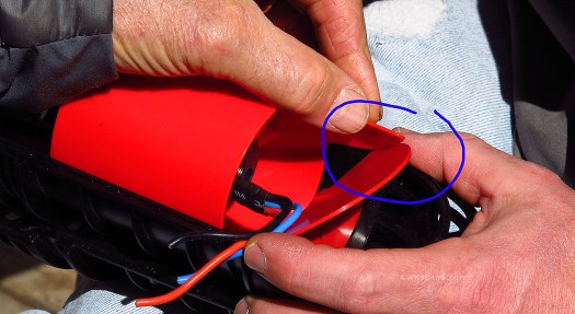 Inside the fan cage, the ducted fan has a 'fang' (circled) that opens the butterfly valve for deflation. 