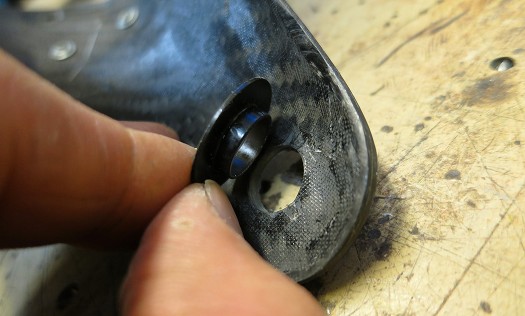 Delrin shoulder bushing is pressed into cuff hole. With normal wear this will be a perfect fit but may require a small amount of enlarging with sandpaper wraped around a drill bit shaft. If the hole is destroyed, B&D may provide an oversized bushing. 