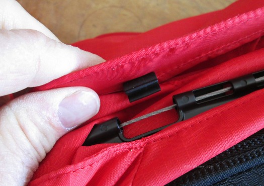 After the bag is deployed you'll see bare cable in the area where the clip is supposed to attach. A simple pull of a 'reset tab' brings the cable back to the closure position with larger diameter that the clip can attach to.