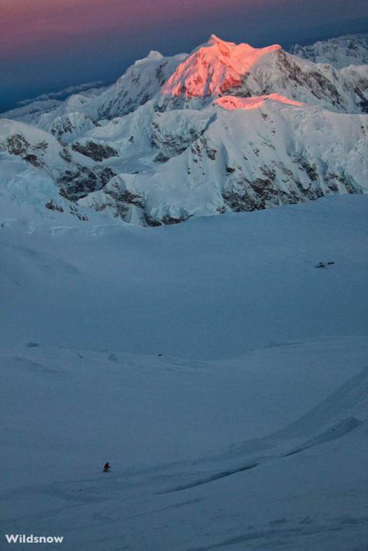Anton skis as the light fades on Mount Hunter.  Of course the light returns in just a couple hours so getting benighted is not too much of a concern. Instead, you're main goal is to keep moving before your physical reserves totally deplete from dealing with the temperatures and maximal effort.
