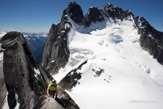 Climbing the beautiful W ridge of Pigeon, with the Howser towers rising in the background.