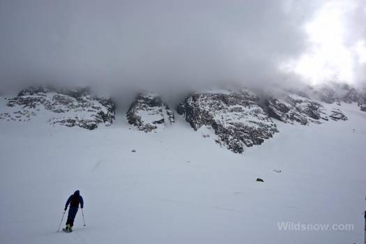 Skinning up below Cerro Arenas, with all but a fraction covered in clouds.