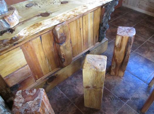 Example of the wood mania, bar stools by the bar.