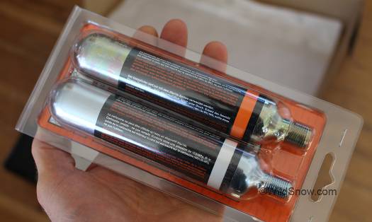 The cartridges. CO2 cartridge is standard issue for inflatable PFDs.  Argon cartridge appears to be similar to those used in wine preservation systems.