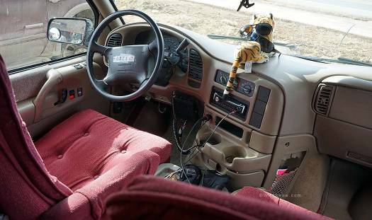 The front area of Steve's 1997 Astro ProVan has airbags, 4 cigarette lighters (excellent for keeping electronic devices charged), CB radio and cup holders.