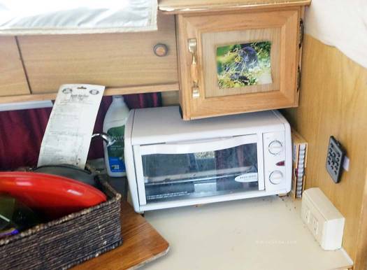 Ovens are available in some Astro ProVans, but not this one.  A standard toaster oven is a fine substitute.  A cookbook is smartly stashed to the side, and a photo of a rare Rwanda silverback mountain gorilla inspires Steve to take El Tigre on adventures far and wide. 