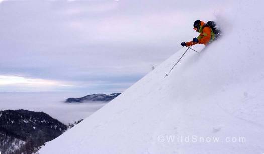 Noah continuing the long tradition of tele turns in soft snow above Scottish Lakes High Camp.