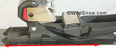 The binding plate slides for and aft by virtue of this track and flange system under the toe.