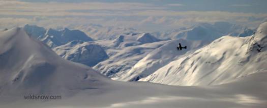 Fly Drake flying past with the expansive Glacier Bay mountains behind. Coolest job in the world.