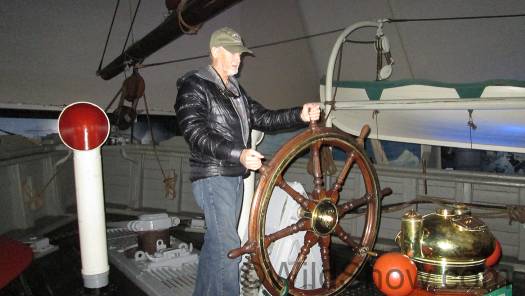 Myself at the helm. The ship propeller was mounted on a vertical shaft so it could be pulled up out of the water and ice.
