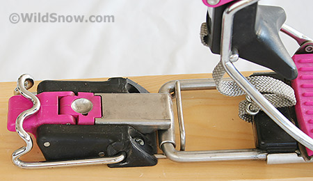Switching from tour to ski mode is done with this simple latch, shown in ski mode. This is operable with a ski pole, and allows an excellent foot-flat-on-ski mode for long low-angled treks while backcountry skiing. View video of touring latch in action. 