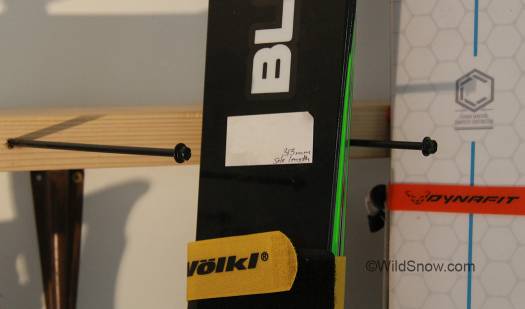 Lags support and separate the angled and leaning skis. 
