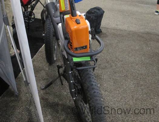 Practical for some folks, including me. E-bike with chainsaw rack.