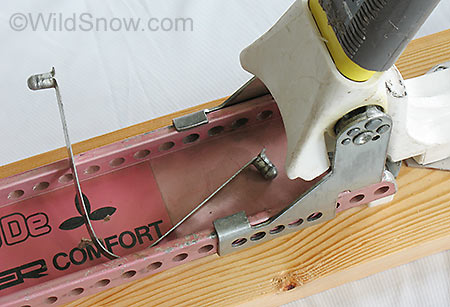 One of the most innovative and succesful features of the comfort (and other Ramer bindings) is easy boot length adjustment. You simply squeeze the U shaped metal clip so the small nubs disengage from holes in the side of the binding, then slide the heel unit for or aft. Micro adjustment is accomplished by the holes on the heel unit being drilled in different frequency than those of the binding plate. This offers a finer adjustment than even some modern bindings.