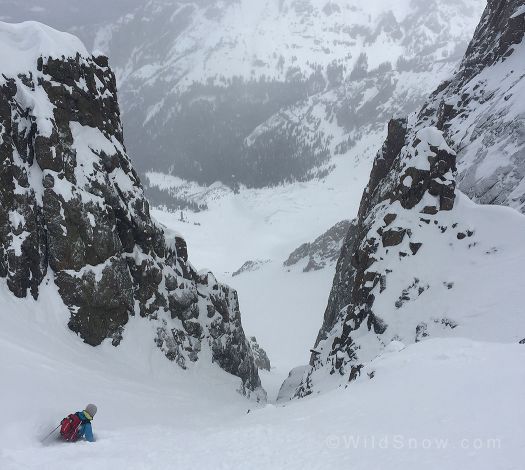 Zach skiing towards the choke of the Snake Couloir.