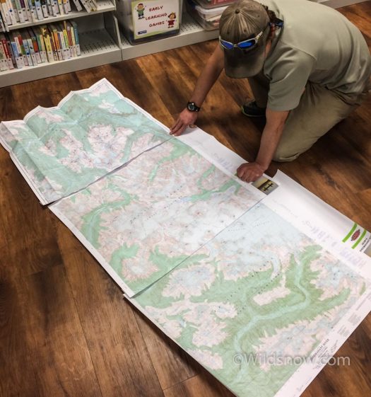 We couldn't find any local maps of the Monarch area, so we bought them in Bella Coola. Here's Eric checking them out on the floor of the local library. 