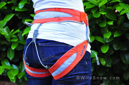 Back/side view. The harness has a gear loop on each side and is compatible for up to four ice screw carabiners.