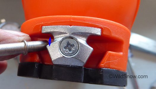 Vertical heel travel of a classic tech binding is dictated by how far the binding pins move down and out of the binding as your heel moves up, a minimal distance as indicated by the arrow.