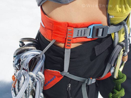 To show how the harness sits on my hips, I’ve removed the padding of my clothing. Both the gear loop and the leg anchor weigh down from the same junction on the belt, which causes a lot of friction and pressure on that one spot on my hips if I’m holding any weight.”