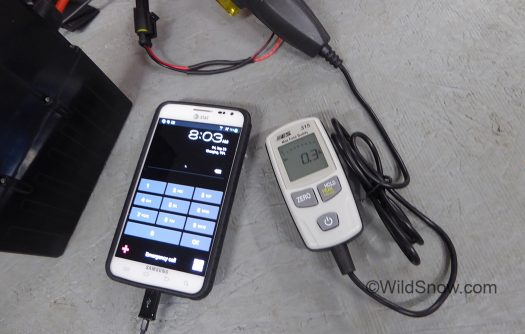 I slapped my in-line amp meter on the harness, the USBbuddy draws about .2 amps with the phone connected and less on standby.