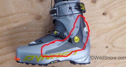 Spine and outside of boot lower shell are reinforced with a fiber composite molded in with the boot plastic.
