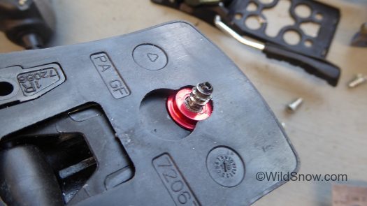 Brake base plate slides over this hidden screw and mushroom fitting.