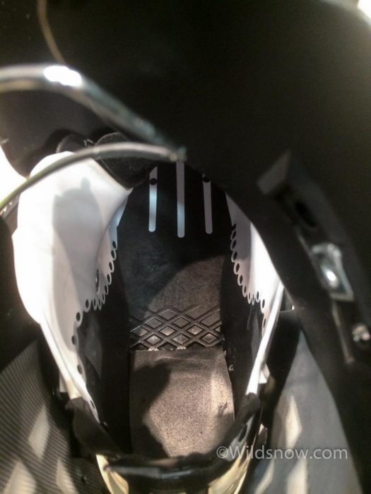 The reinforced LFT plastic (black) extends under the entire length of the boot. This photo is taken looking down at the inside of the boot shell, the toe of the boot is towards the top of the photo.