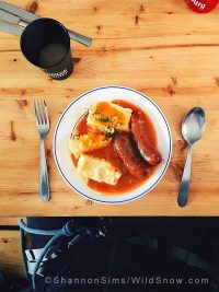 This is why I ski in France.  Local pork sausage (name that sausage!), cheesy polenta cakes, and a sauce of course.  Plus hot chocolate and a Kronenbourg.  Photo by Shannon Sims.