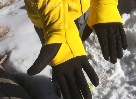 Thumb loops fit over light gloves.