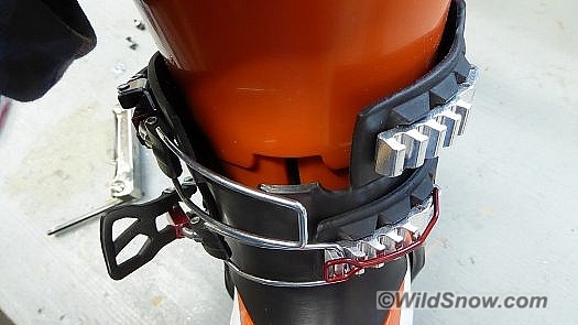 Secret sauce, the darker part matches up with  the orange cutout, locking together when the boot is buckled.