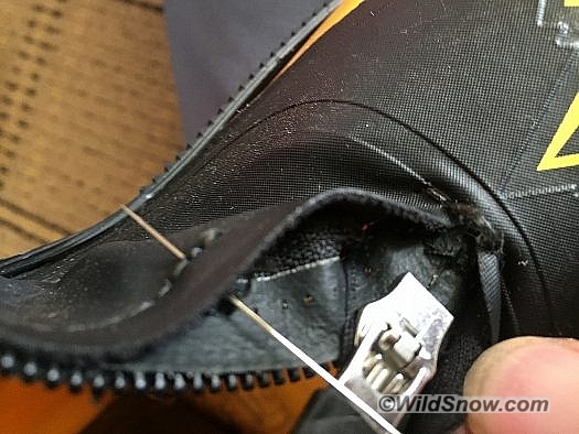 Starting at the top of the break, stitch the zipper back to the cuff using the existing holes. Using the existing holes ensures that zipper will function correctly and not jam after repair. This is time consuming but the end result will look better than adding your own holes.