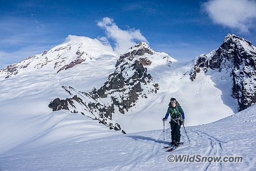 Mike nears the lightning rod with (left to right) Mount Baker, Colfax Peak, Lincoln Peak, and the Thunder Glacier in the background.