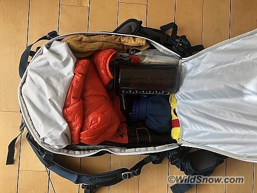 With the airbag system taking up minimal space there is ample room in the main compartment. Here I’ve got a rescue sled, repair kit, first aid kit, water, gloves, micro-puff, snow-study kit, and snacks with room to spare.