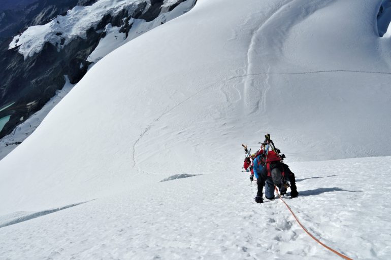 Ascending steep summit slopes on Chumpe