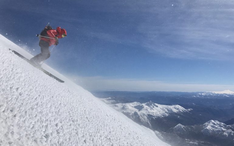 Doug skis questionable "snow" off the summit of Volcán Lanín.