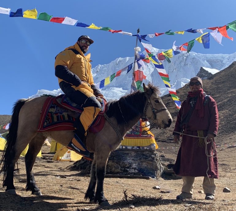 Blake embraces the local forms of transportation in the Himalaya.