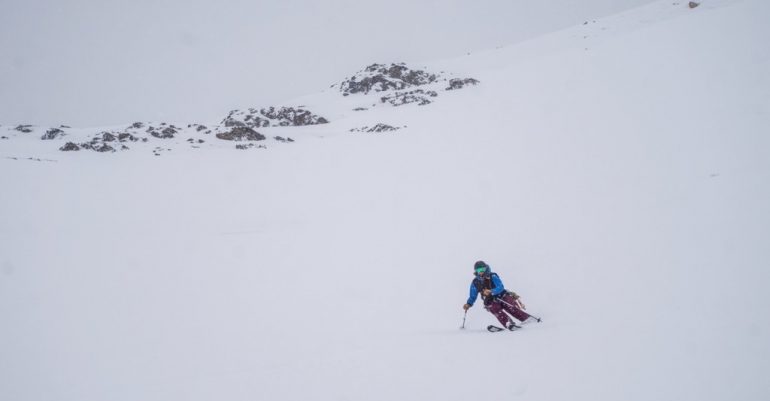 Morgan searching for contrast in a near whiteout enjoying her first turns of the season