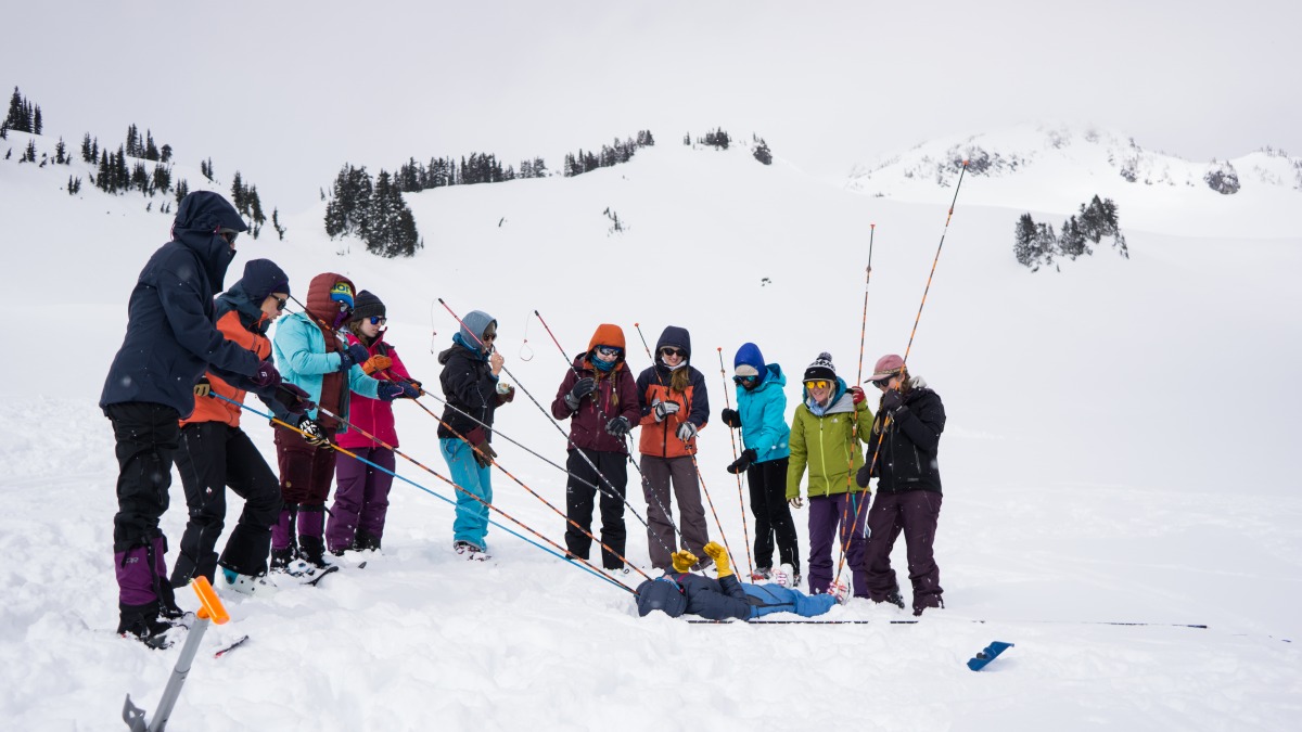 Student learning how to use their probe in an AIARE Level 1 course at Mountain Rainier 