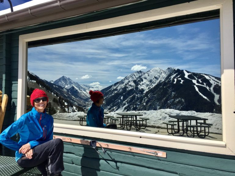 Reflected in the summit restaurant window, the view does not disappoint.